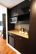 The pantry comes with a microwave oven, cups, plates, water kettle and a mini-bar refrigerator.